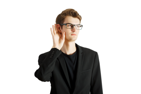 Man in a suit and glasses holding hand to his ear, posing on white background, concept of listening, rumor or gathering information