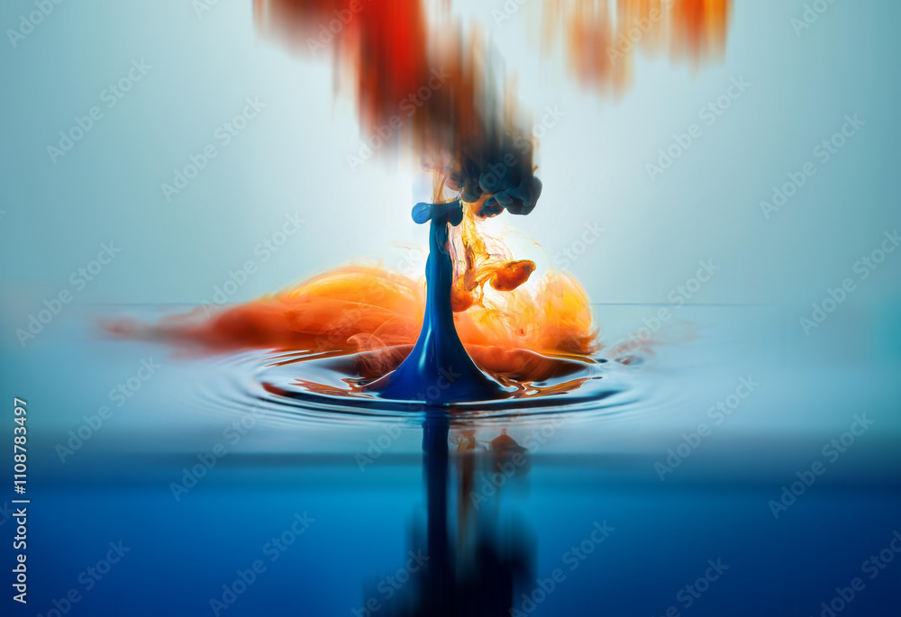 Aufkleber a blue droplet falls into water, creating a vibrant explosion of orange and red colors. the resultin