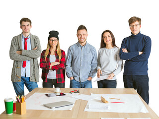 Young team of five people standing confidently behind a desk with papers, laptop, and stationery,...