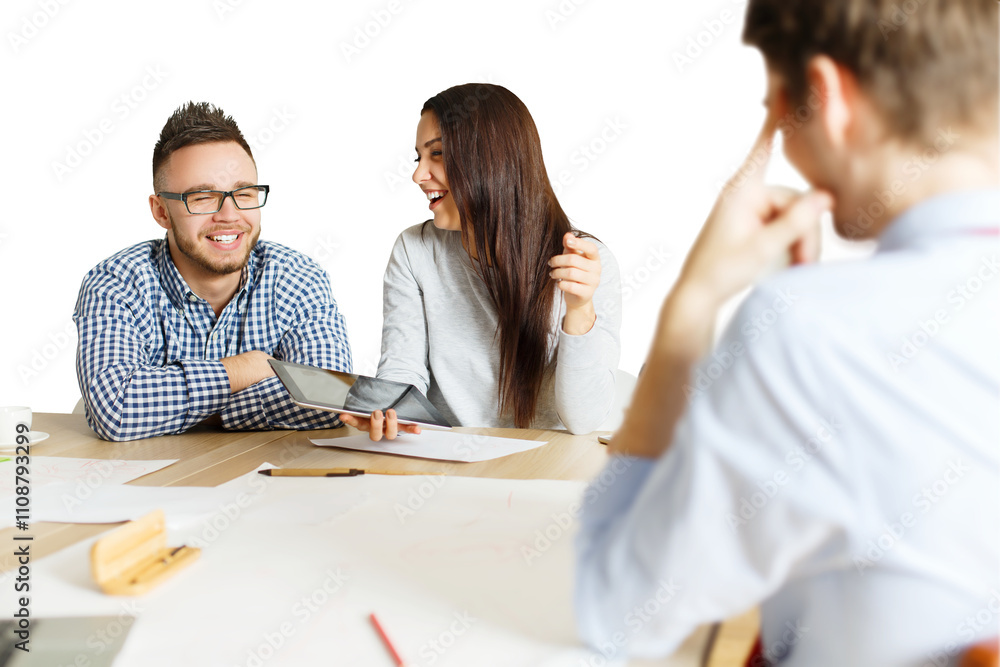 Poster three colleagues collaborating at a desk, one holding a tablet, on a white background. focused on te