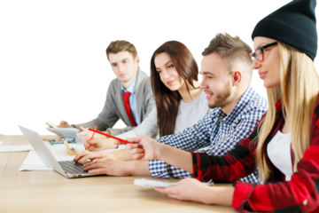 Group of young professionals collaborating on a project, using a laptop and documents, sitting at a desk, on a white background, teamwork concept