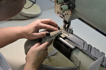sewing factory sew fabric seamstress knitwear wool hands toy slippers red sewing machine iron...