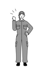Fototapeta premium A mechanic woman in coveralls posing with guts.