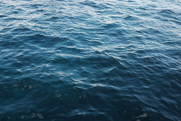 Emerald green waters and turquoise surface of calm blue sea wave and water background. Travel destination summer of ocean
