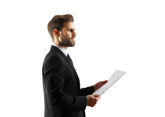 Professional businessman wearing a suit holding a document in hands, isolated on a clean white background, concept of business professionalism