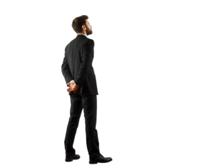 Man in a formalsuit standing with hands clasped behind on a white background, isolated view. Represents professionalism and business style