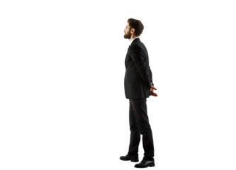 A man in a formalsuit standing in profile, hands clasped behind his back, on a white background. Business concept