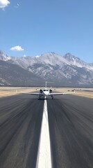 Fototapeta premium A private jet sits on the runway poised for takeoff sleek and modern against the backdrop of a clear sky