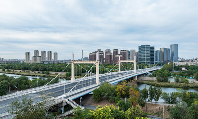 Fototapeta premium Aerial view of Xihe Bridge building in Tianjin
