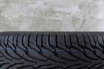 Car Parts - Closeup fragment new car winter tire