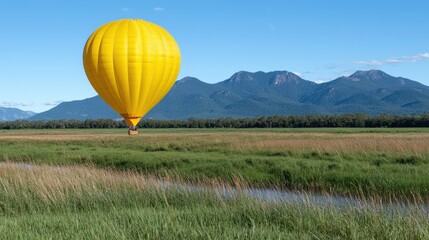 Fototapeta premium Scenic Hot Air Balloon Ride over Lush Green Fields and Mountains