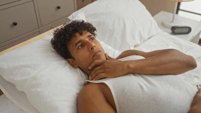 Young, hispanic, man, lying, bed, thinking, bedroom, home, adult, pondering - Powered by Adobe