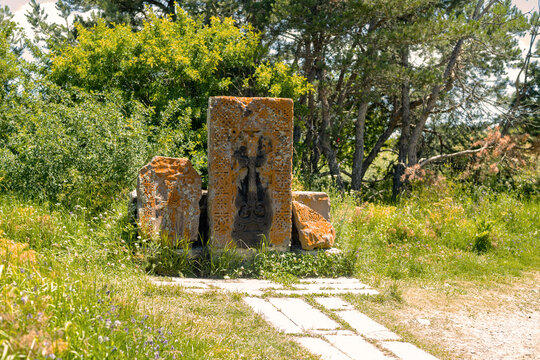 Sevanavank monasterys ancient stone carvings showcase historical significance amid lush greenery and peace.