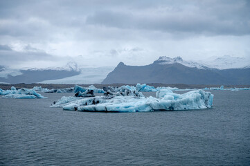 Scenic landscape of Jokulsarlon. Glacial lake in Iceland. Cloudy weather. Icelandic nature. Blue ice...