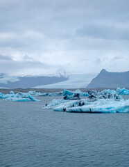 Scenic landscape of Jokulsarlon. Glacial lake in Iceland. Cloudy weather. Icelandic nature. Blue ice...