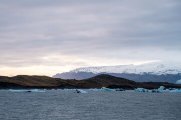 Scenic landscape of Jokulsarlon. Glacial lake in Iceland. Cloudy weather. Icelandic nature. Blue ice...
