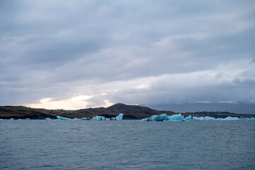 Scenic landscape of Jokulsarlon. Glacial lake in Iceland. Cloudy weather. Icelandic nature. Blue ice...