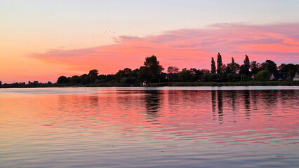 Naklejka premium View on Dutch water sports village during sunset, Oudega, Friesland, Netherlands