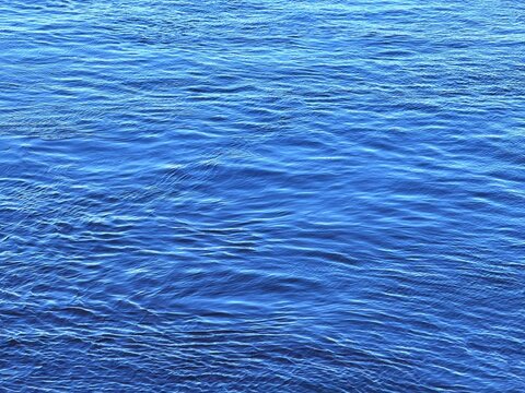 Blue rippled river water surface.