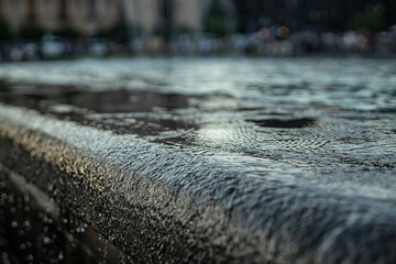 Soft droplets create mesmerizing patterns as they fall into the fountain, inviting calmness and...