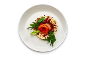A plate of food with a variety of vegetables and fruits, including tomatoes