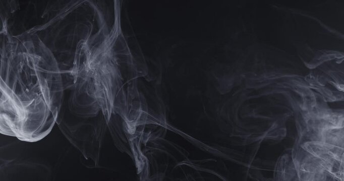 Abstract image of dark room concrete floor. Black room or stage background for product placement.Panoramic view of the abstract fog. White cloudiness, mist or smog moves on black background. 