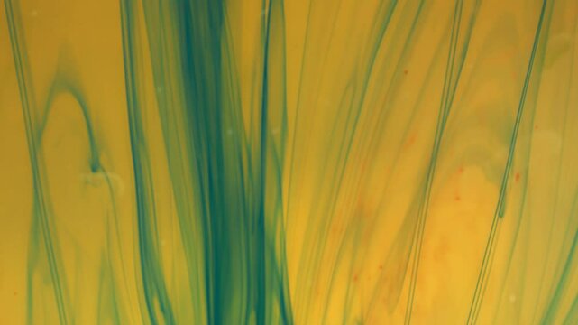 Abstract background. Colored streaks create structures under the influence of water.