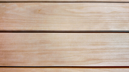 Close-up of smooth wooden planks, ideal for illustrating building materials, carpentry projects, or...