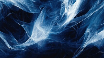Fototapeta premium Abstract blue smoke swirling in a dark background 