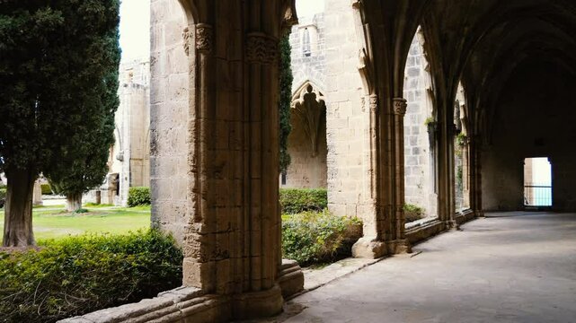Slow motion walk through the famous arched ruins of Bellapais monastery.