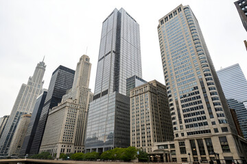 A Collection of Tall Office Buildings in a Realistic Image: Showcasing Modern Architecture, Skyscrapers, and Urban Cityscape