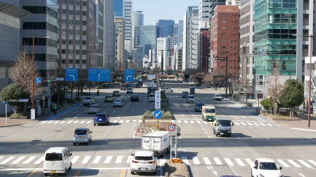 aerial street landscape traffic view at intersection among business financial district street area of Nagoya city center in sunny day time