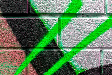 Art under ground. Beautiful street art graffiti background. The brick wall is decorated with abstract drawings house paint. Modern style urban culture of street youth. Abstract picture on wall © Yaroslav