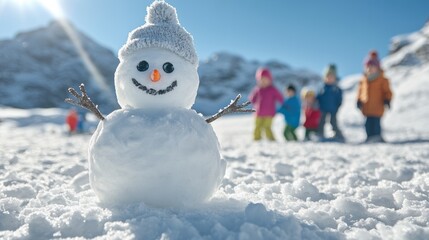 Fototapeta premium Kids playing in sunny alpine snowfield with snowman