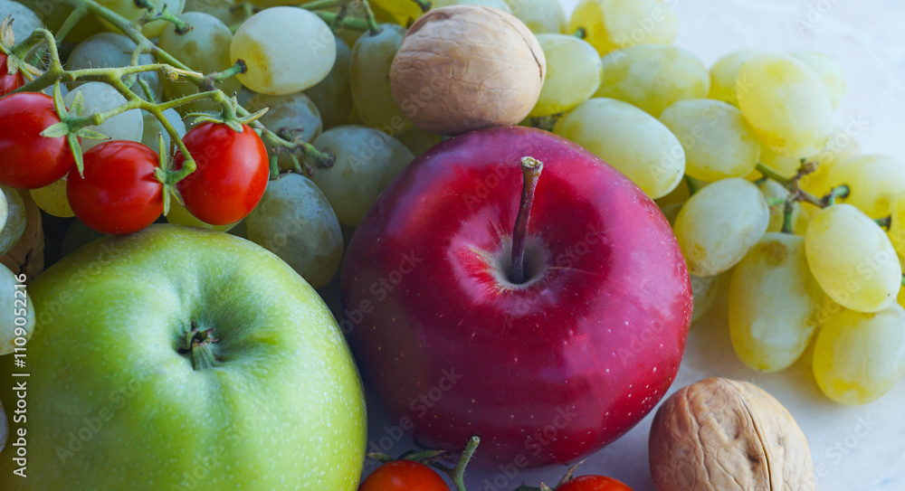 Wall mural Grapes and other fruits on the table