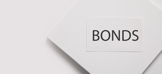 Fototapeta premium Bonds word on business card. Business concept