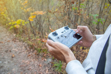 Caucasian man using drone controller.