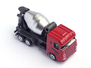high angle view of cement mixer truck toy isolated on white background. red color truck head...