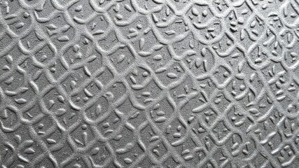 Close-up of a textured surface with intricate geometric patterns, creative, abstract