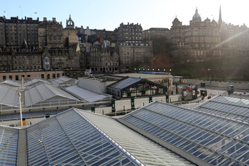 Glass roof of the waverley railway station with old city in the background - Edinburgh - Lothian - Scotland - UK