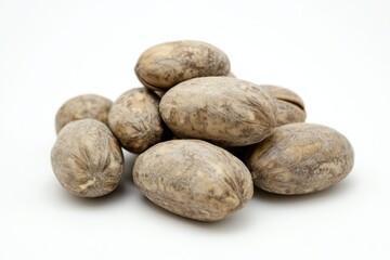 Obraz premium A collection of nuts arranged on a white surface