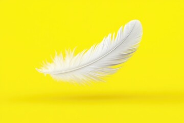 Obraz premium A single white feather drifting through the air on a bright yellow background, suitable for use in illustrations or designs where simplicity and elegance are key
