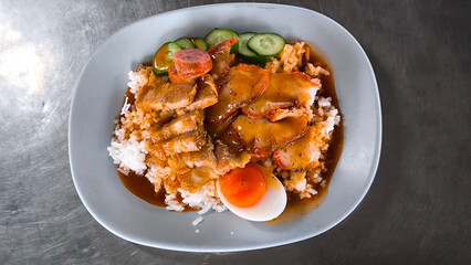 Red pork and crispy pork on rice, food in Thailand
