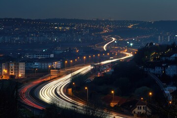 Fototapeta premium Nighttime cityscape with blurred car lights and building silhouettes