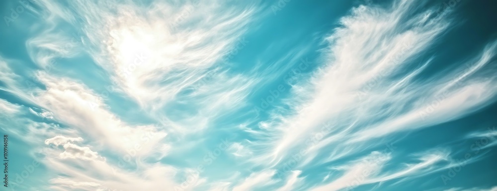 Aufkleber A serene sky filled with soft, wispy clouds against a bright blue backdrop, creating a tranquil and uplifting atmosphere.