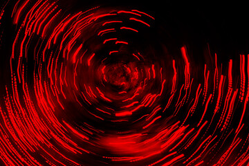 Red energy swirl glowing lines forming a vortex. Concept of space travel, fast movement,...
