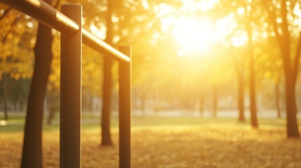 Fototapeta premium Peaceful autumn park with fitness bars glowing in warm sunlight, surrounded by colorful trees. Ideal spot for exercise and wellness