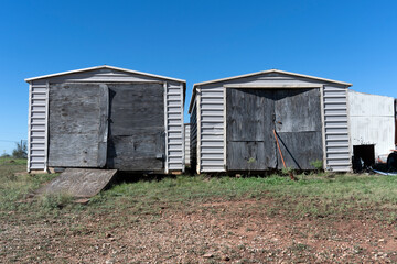 Wooden doors on metal shacks