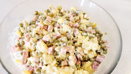 chopped Olivier salad, eggs, potatoes, cucumber, sausage.