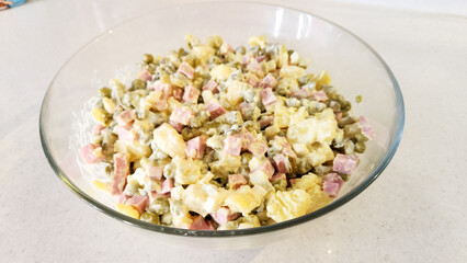 chopped Olivier salad, eggs, potatoes, cucumber, sausage.